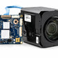 FCB-ER9100 camera, shown alongside a interface board with connecting cable