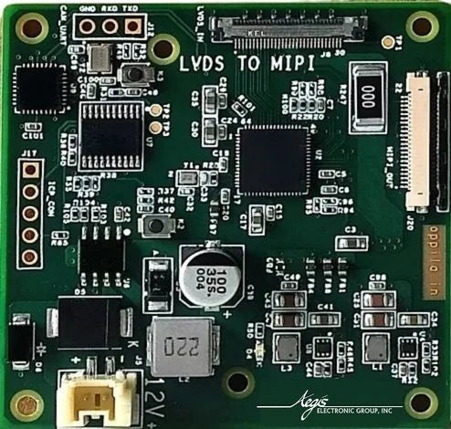 Electronic circuit board with various components on a green background