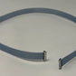 Gray flat micro coaxial cable with connectors on a white background