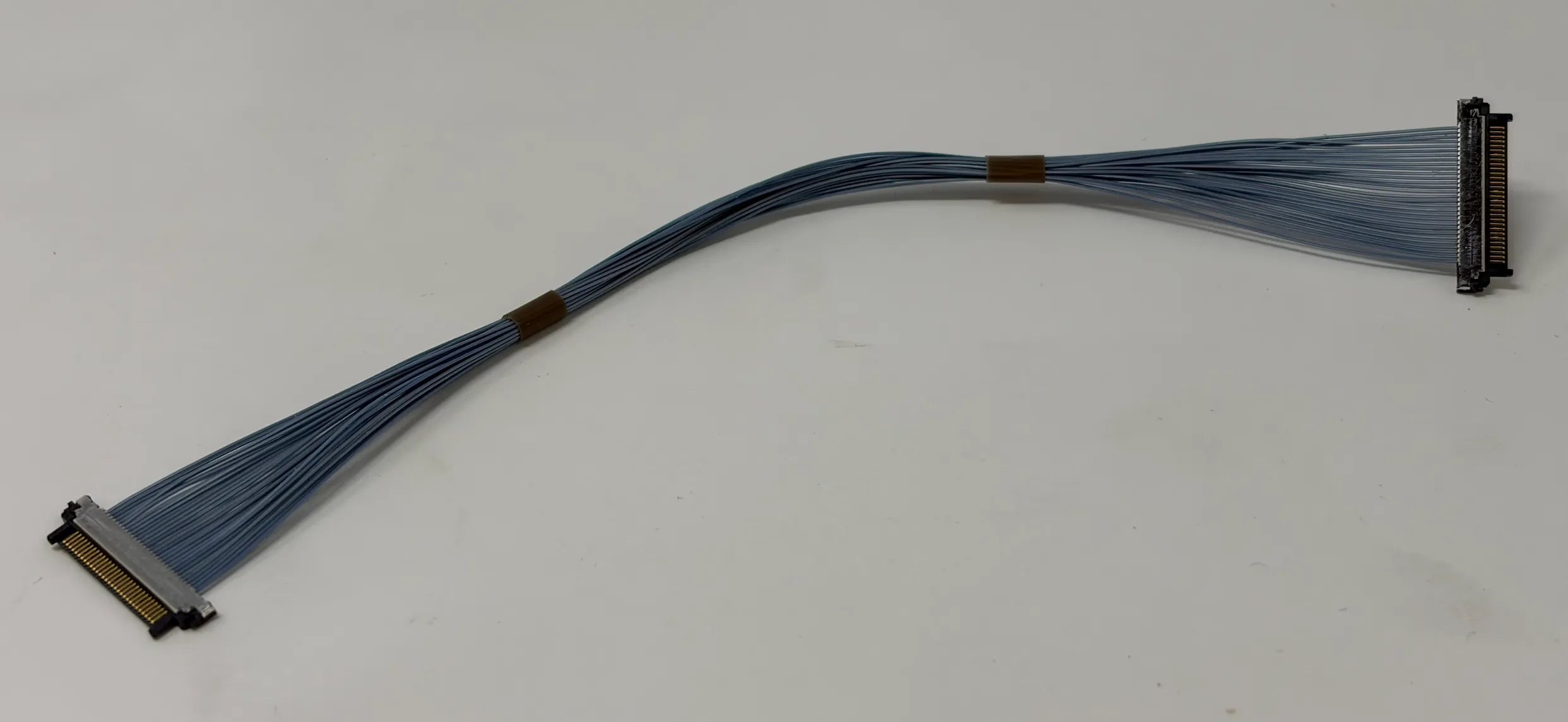 Micro Coaxial Cable with connectors on a white background