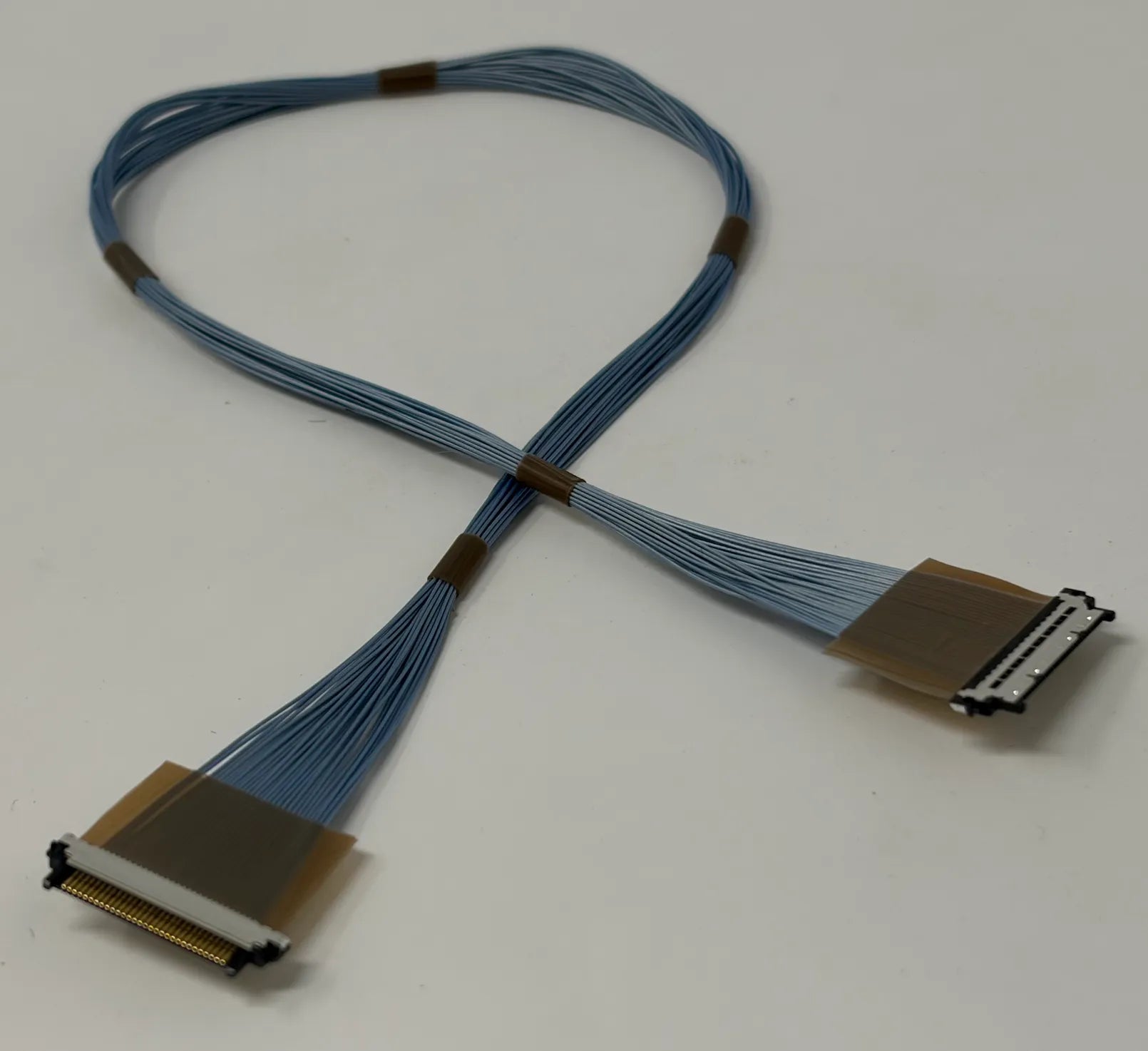 Micro coaxial cable with connectors on a white background